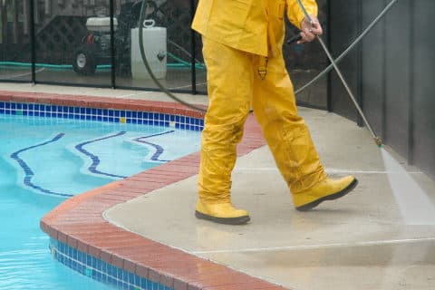 Pressure washing a pool deck